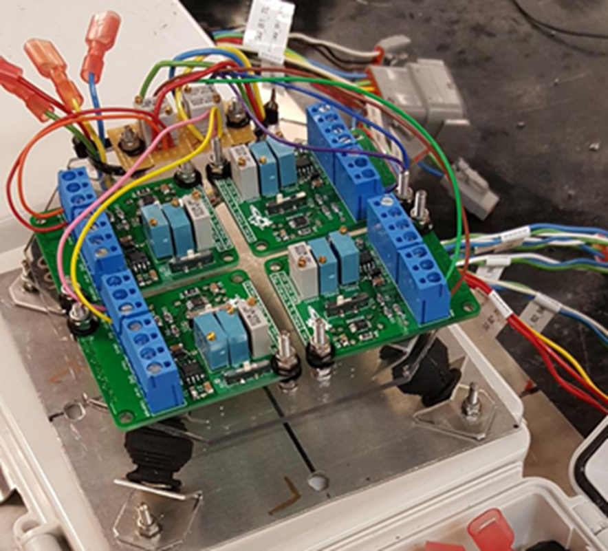 Image of strain gage signal conditioning boards mounted into waterproof enclosure.